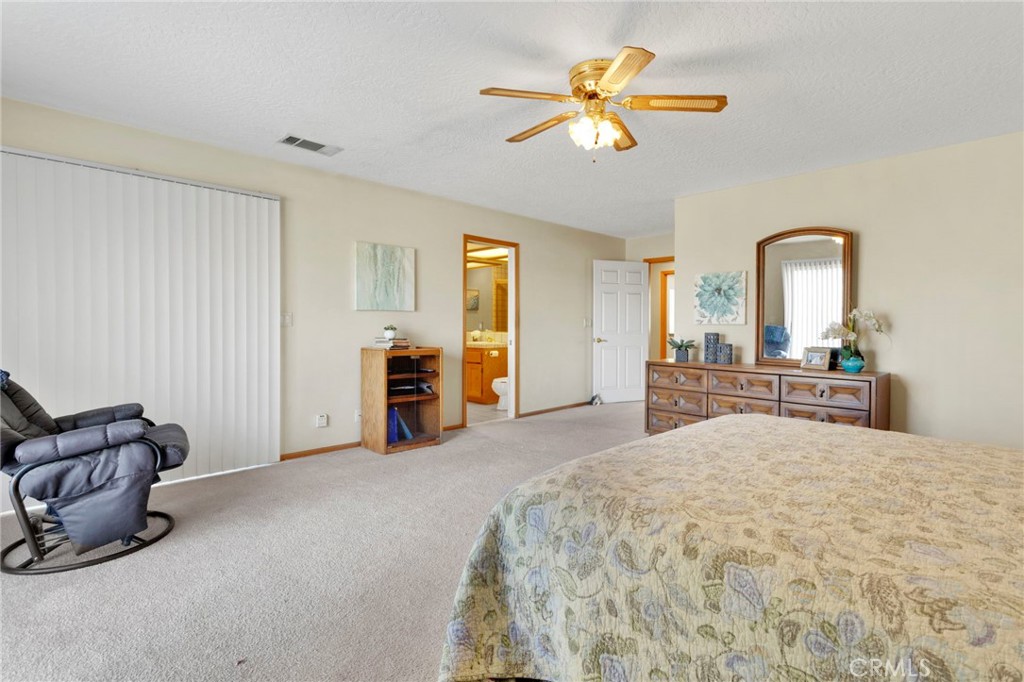 11062 Hollister Road Oak Hills, CA 92344 - Photo 30 of 69 a living room with furniture and a flat screen tv