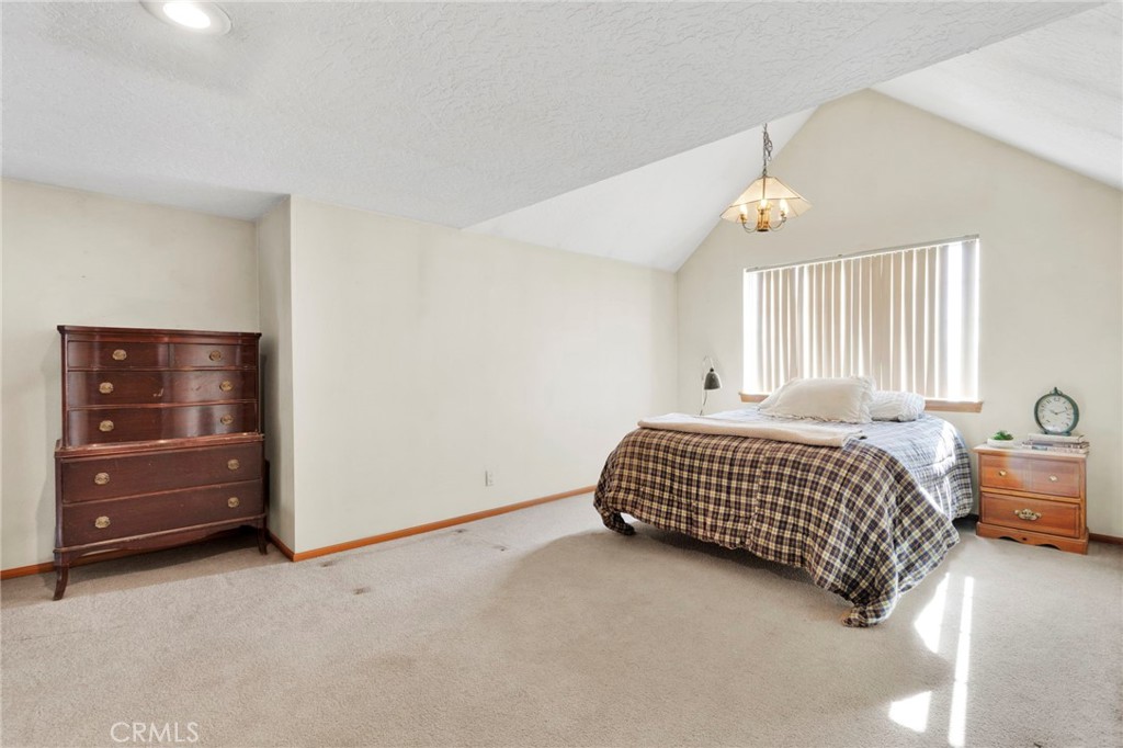 11062 Hollister Road Oak Hills, CA 92344 - Photo 41 of 69 a bedroom with a bed and window