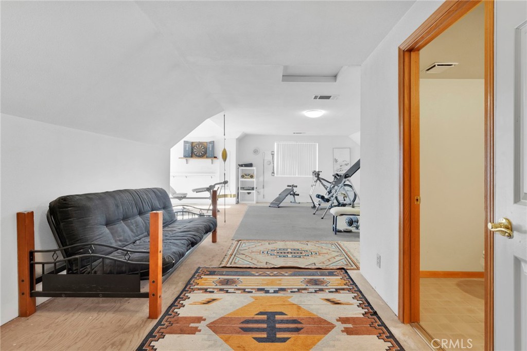 11062 Hollister Road Oak Hills, CA 92344 - Photo 43 of 69 a view of living room with furniture and a rug