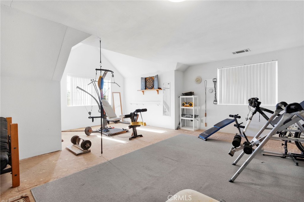 11062 Hollister Road Oak Hills, CA 92344 - Photo 45 of 69 a view of a room with gym equipment