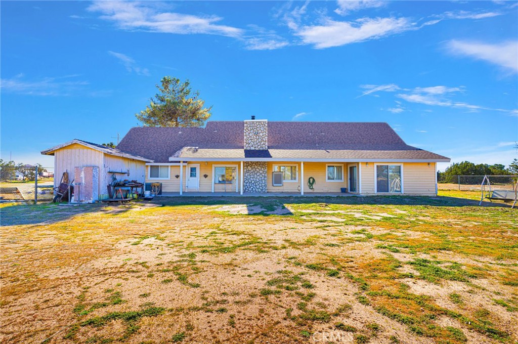 11062 Hollister Road Oak Hills, CA 92344 - Photo 52 of 69 a front view of a house with a yard