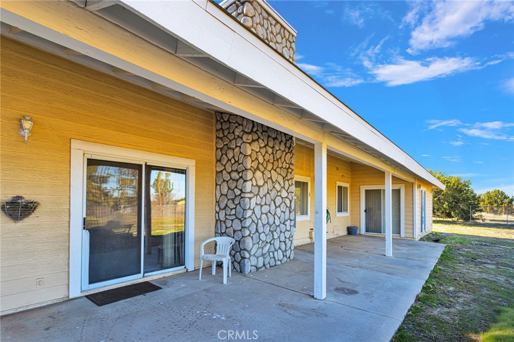 11062 Hollister Road Oak Hills, CA 92344 - Photo 54 of 69 a front view of a house with a porch