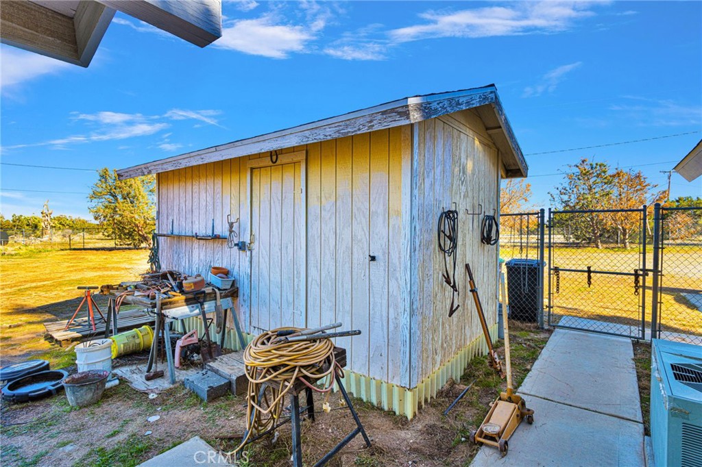 11062 Hollister Road Oak Hills, CA 92344 - Photo 55 of 69 a view of an chairs and table in the balcony