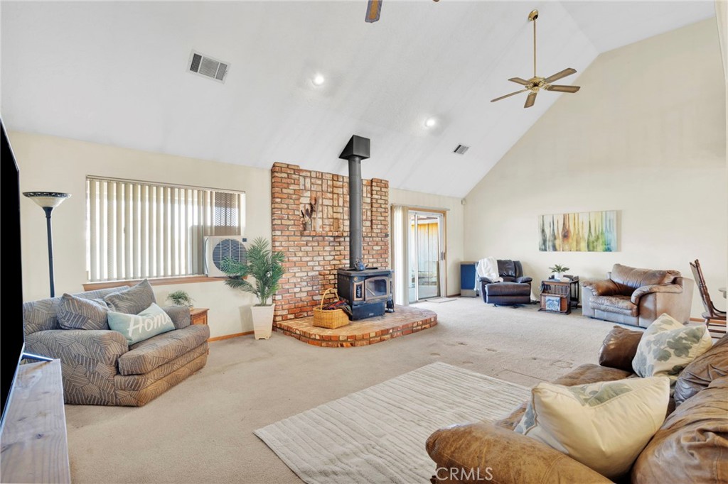 11062 Hollister Road Oak Hills, CA 92344 - Photo 8 of 69 a living room with furniture and a large window