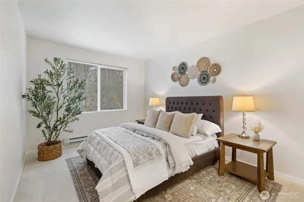 a bedroom with a bed and lamps