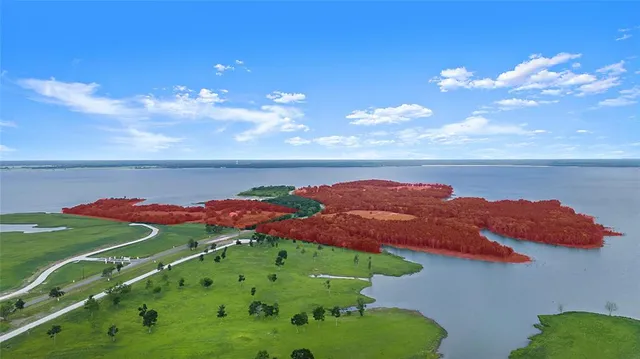 a view of a lush green hillside and a houses