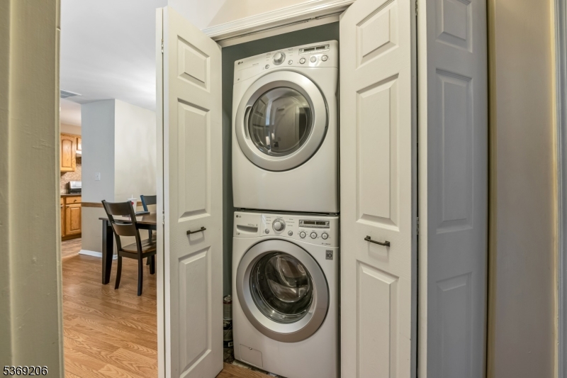 1096 Coventry Way Mahwah, NJ 07430 - Photo 14 of 28 a view of a hallway with washer and dryer