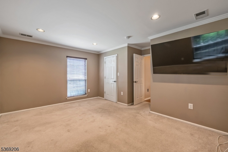 1096 Coventry Way Mahwah, NJ 07430 - Photo 18 of 28 a view of an empty room with a window