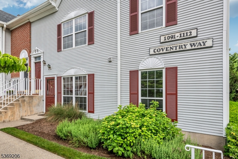 1096 Coventry Way Mahwah, NJ 07430 - Photo 2 of 28 a view of a house with a yard and plants