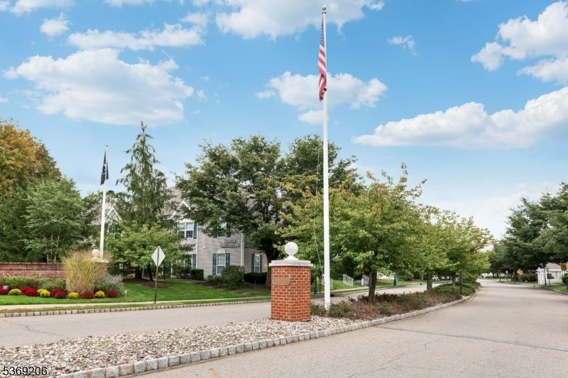1096 Coventry Way Mahwah, NJ 07430 - Photo 26 of 28 a street sign on a sidewalk next to a road