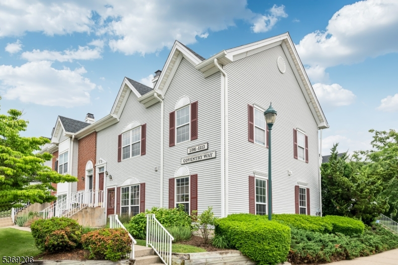 1096 Coventry Way Mahwah, NJ 07430 - Photo 28 of 28 a view of a white house next to a yard