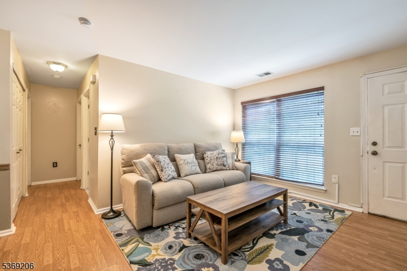 1096 Coventry Way Mahwah, NJ 07430 - Photo 3 of 28 a living room with furniture and a gate