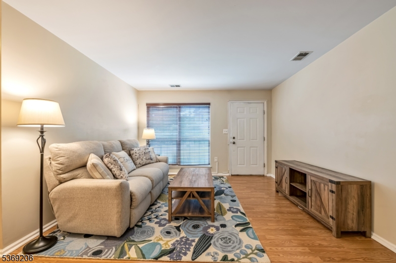 1096 Coventry Way Mahwah, NJ 07430 - Photo 5 of 28 a living room with furniture and a rug