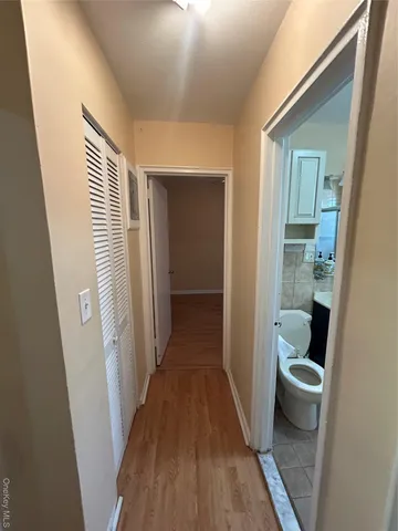 a bathroom with a sink mirror and a bathtub
