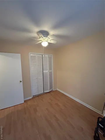 an empty room with fan