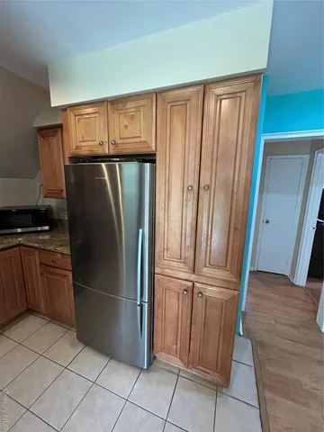 a kitchen with stainless steel appliances granite countertop a sink stove and microwave