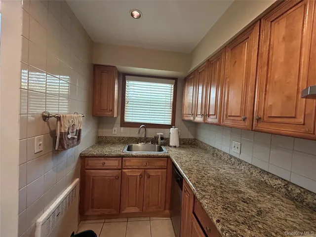 a stove top oven sitting inside of a kitchen