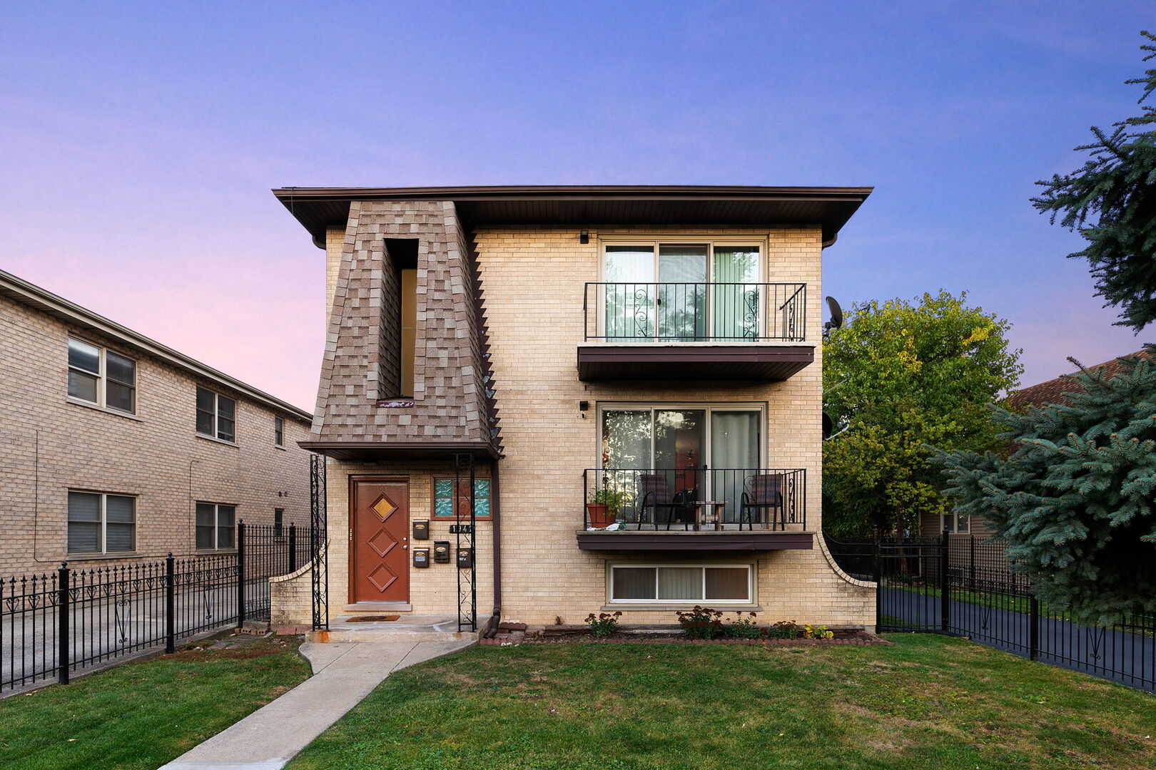 a front view of a house with garden