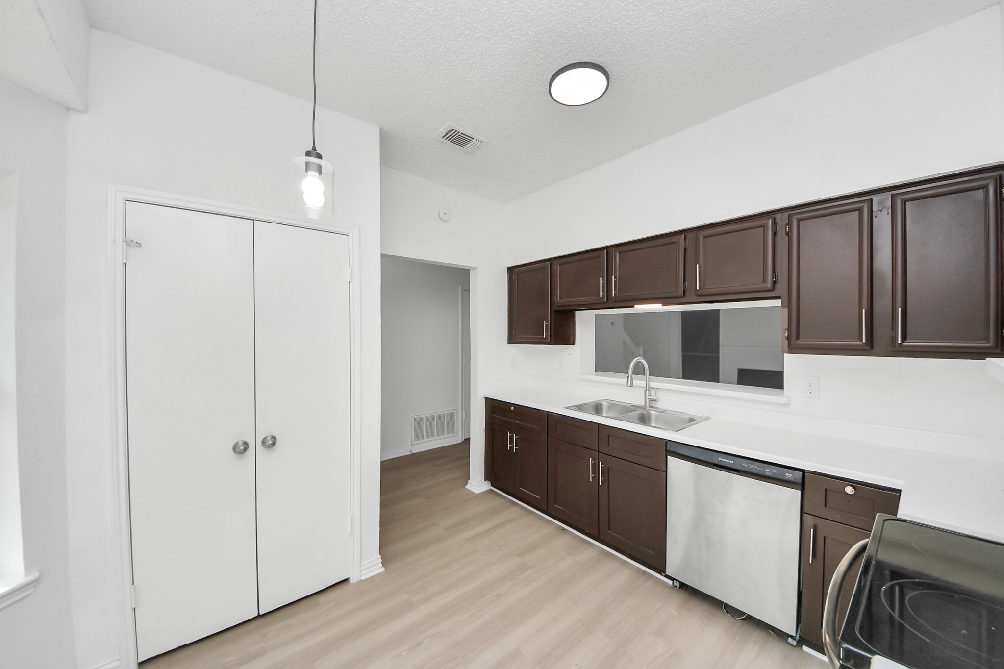 a kitchen with stainless steel appliances a refrigerator and a stove