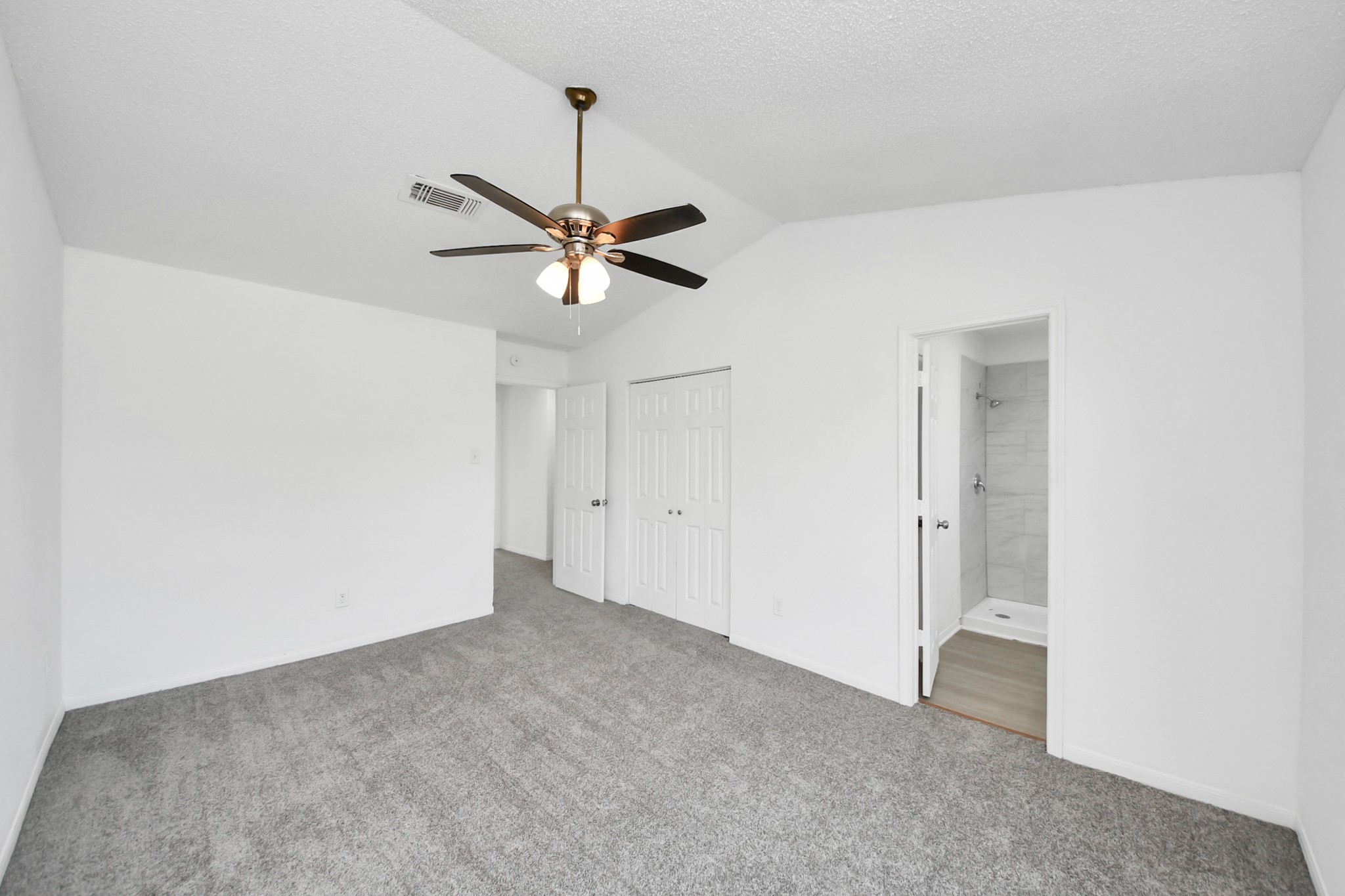 12500 Brookglade Circle, Unit 176 Houston, TX 77099 - Photo 19 of 25 an empty room with a ceiling fan and a fan