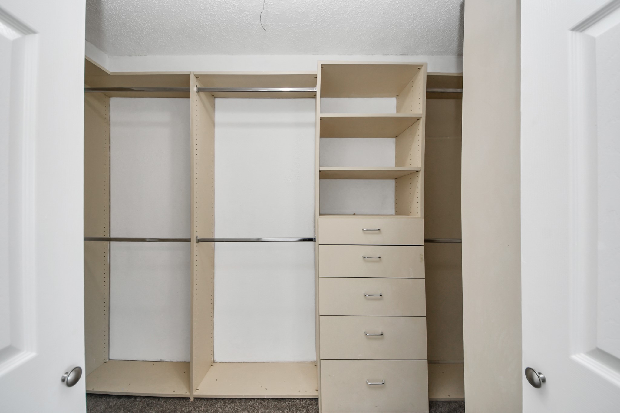 12500 Brookglade Circle, Unit 176 Houston, TX 77099 - Photo 21 of 25 a view of walk in closet with empty racks