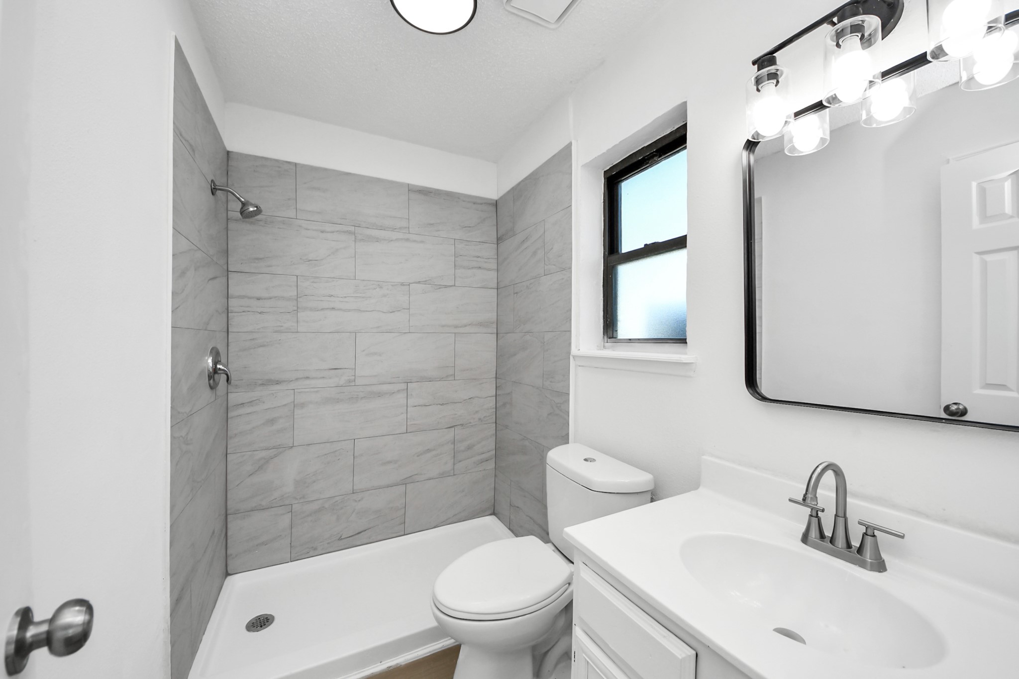 12500 Brookglade Circle, Unit 176 Houston, TX 77099 - Photo 23 of 25 a bathroom with a sink a toilet and shower