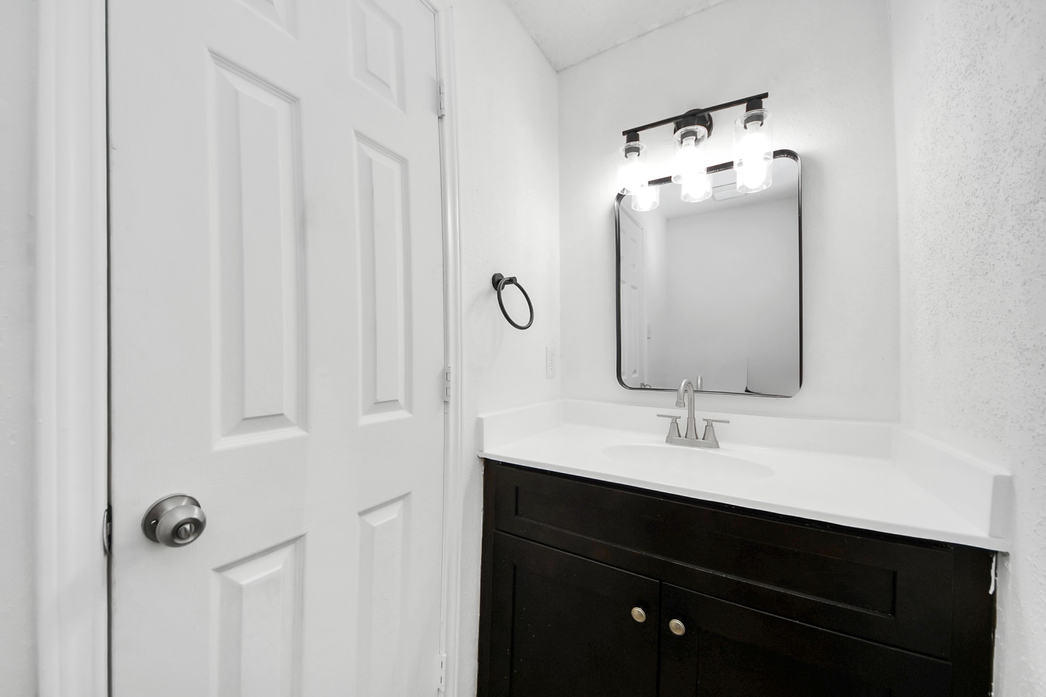 12500 Brookglade Circle, Unit 176 Houston, TX 77099 - Photo 7 of 25 a bathroom with a sink vanity and mirror
