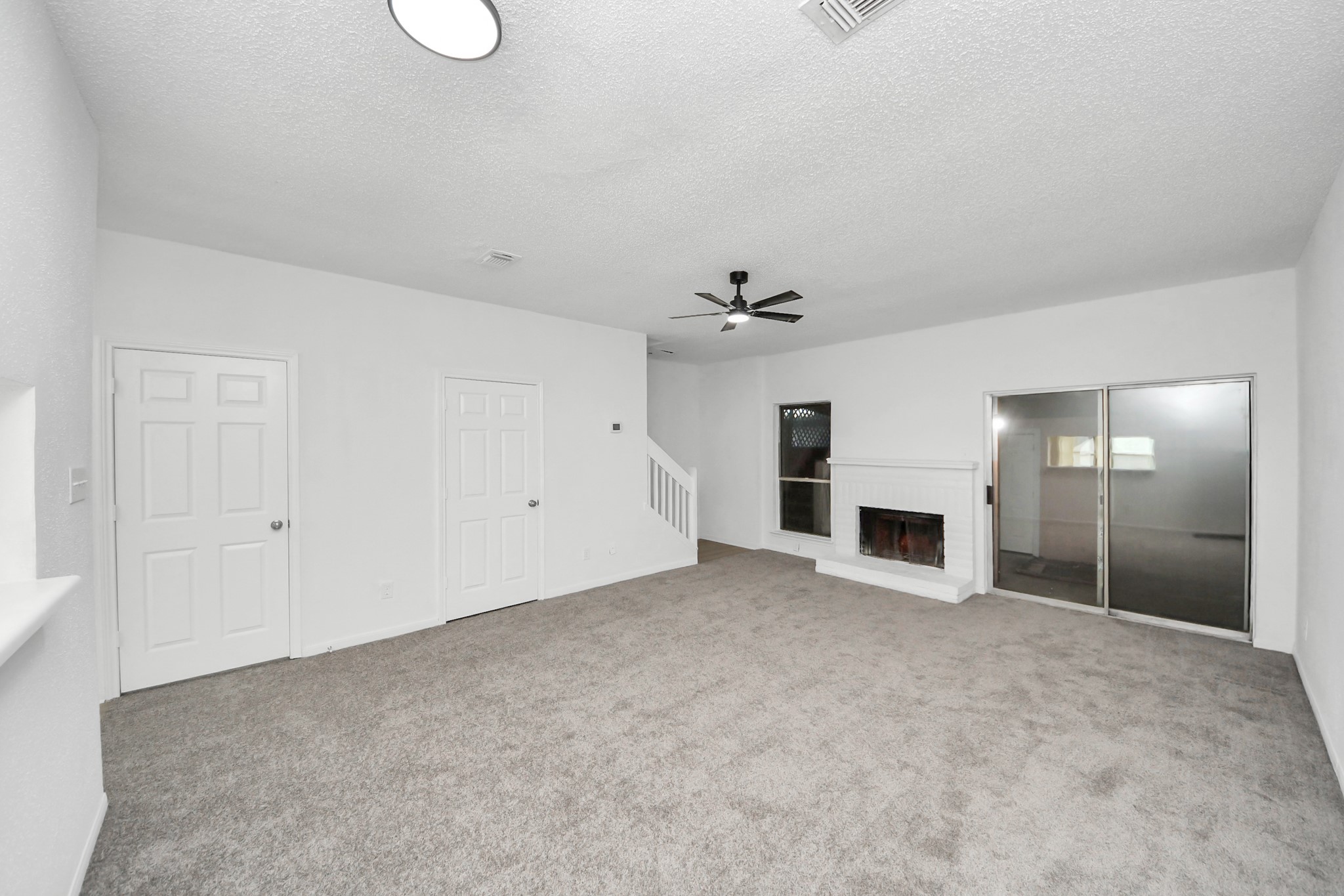 12500 Brookglade Circle, Unit 176 Houston, TX 77099 - Photo 8 of 25 a view of empty room with a fireplace