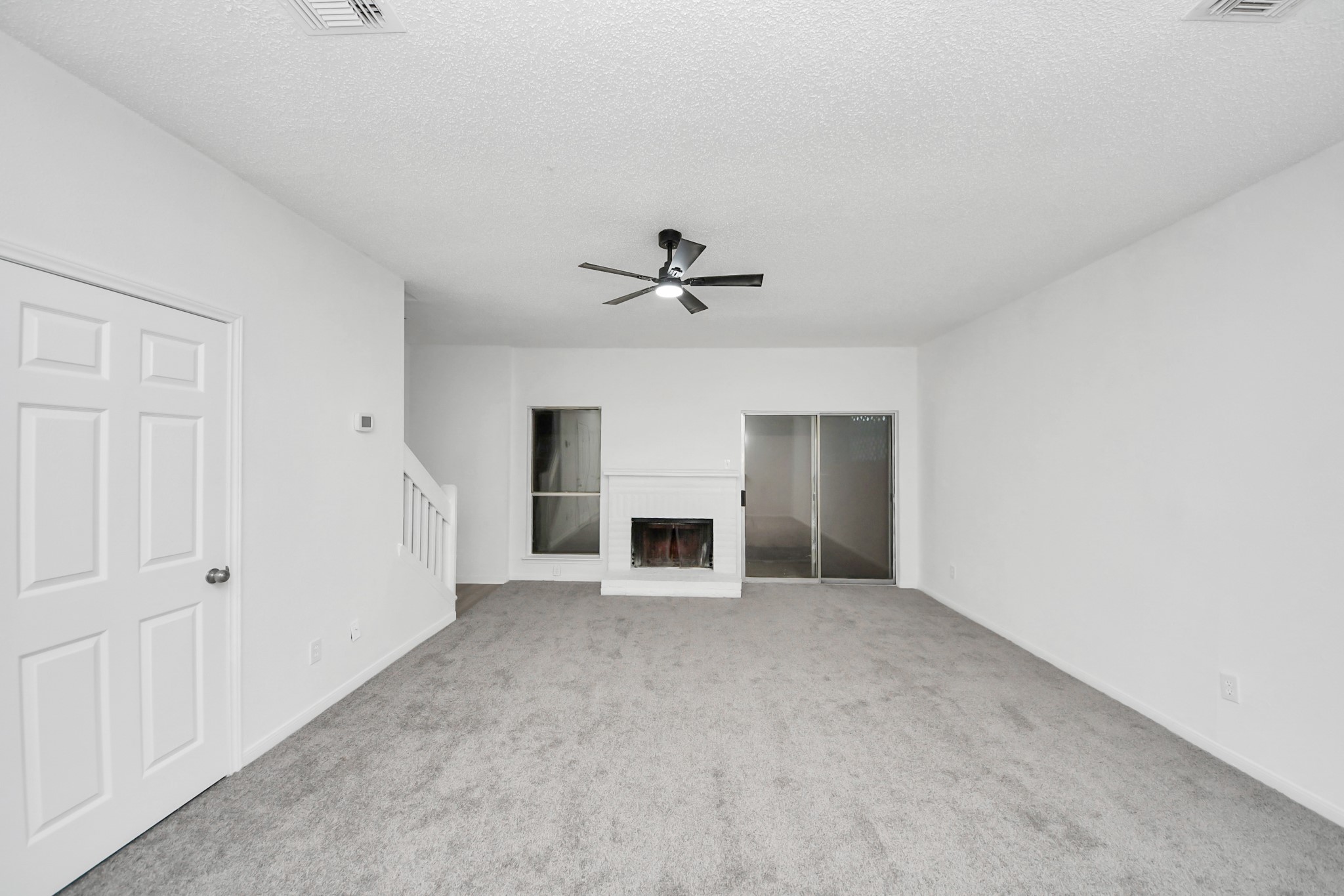 12500 Brookglade Circle, Unit 176 Houston, TX 77099 - Photo 10 of 25 a view of a livingroom with a fireplace and window