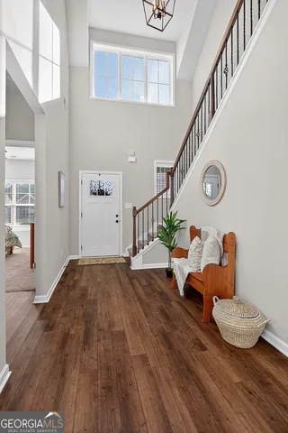 a view of livingroom and dining room with wooden floor