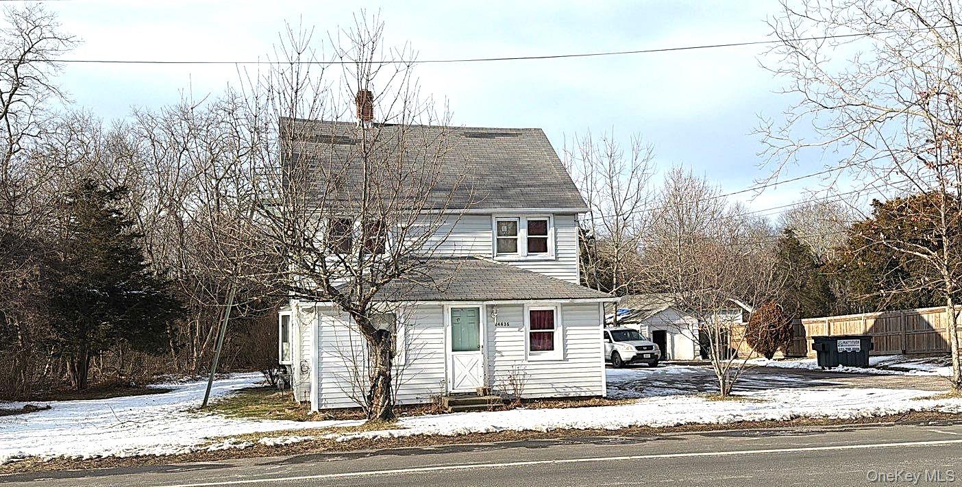 24635 Main Road Cutchogue, NY 11935 - Photo 2 of 4 a view of a house with snow on the road