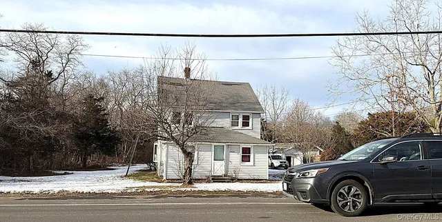 a view of a car parked front of a house