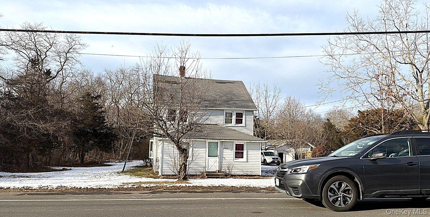 24635 Main Road Cutchogue, NY 11935 - Photo 4 of 4 a view of a car parked front of a house