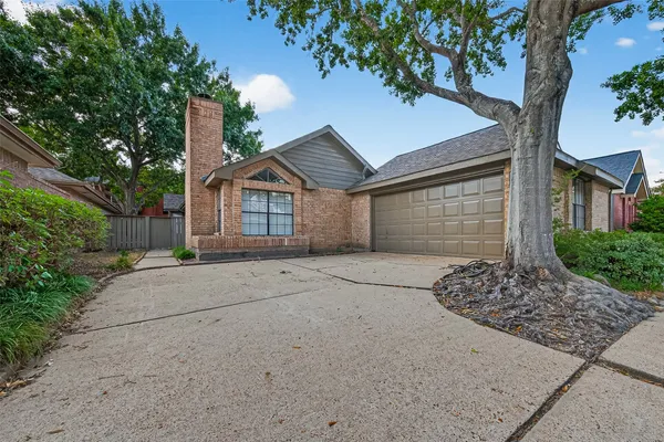 a house with a tree in front of it