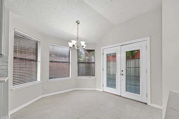 a view of empty room with windows