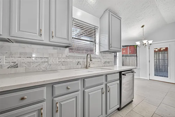 a kitchen with a stove and a refrigerator