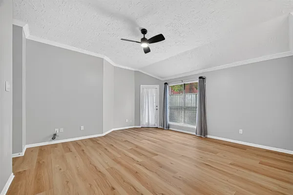 a bathroom with a granite countertop toilet sink and mirror