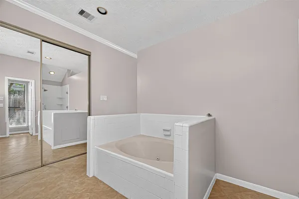 a bathroom with double sink and a mirror