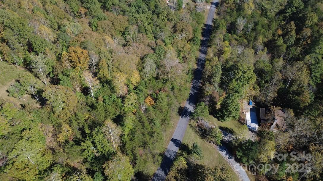 Tbd Cross Creek Drive, Unit 140 Rutherfordton, NC 28139 - Photo 7 of 17 a view of a house with a lush green forest