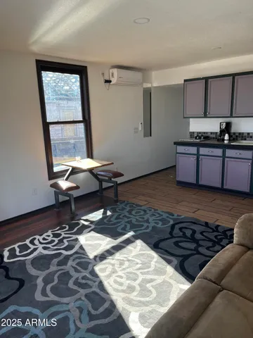 a living room with a couch and a rug