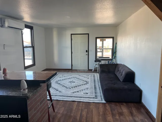 a living room with a couch and dresser