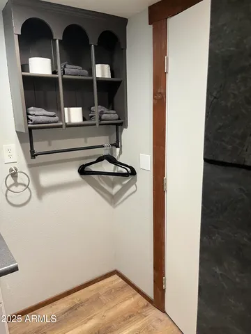 a view of a closet with storage
