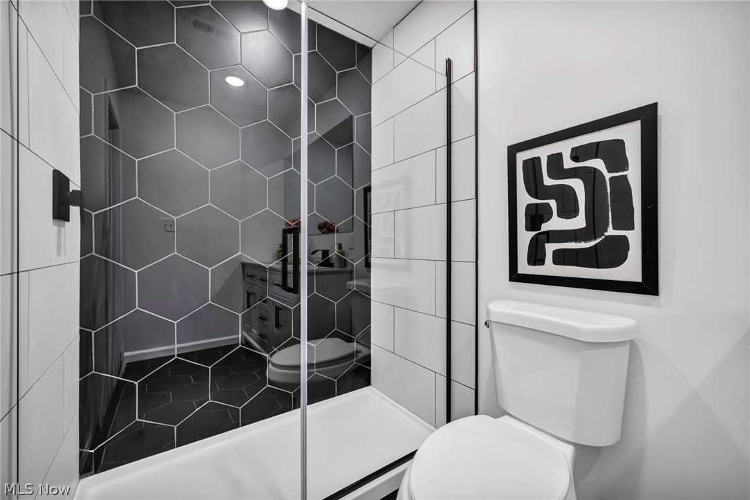 3670 Pennington Road Cleveland, OH 44120 - Photo 16 of 28 Bathroom featuring toilet and a shower stall