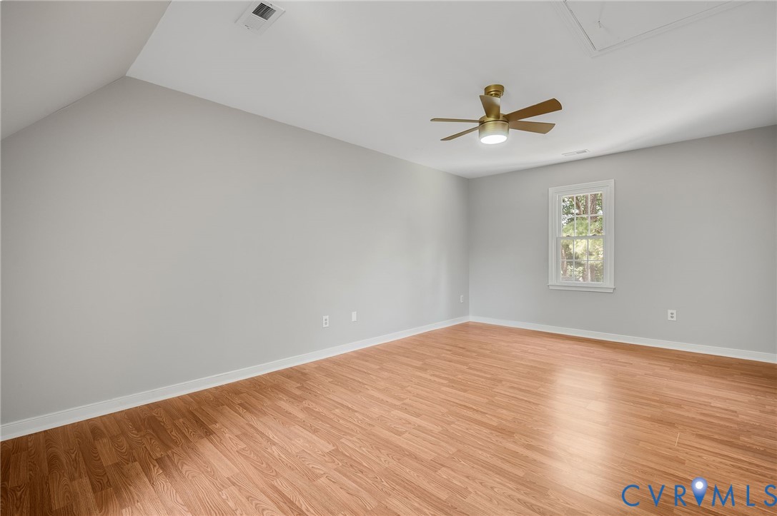 10110 Holly Road Mechanicsville, VA 23116 - Photo 25 of 26 Spacious room featuring wood-finish flooring, ligh