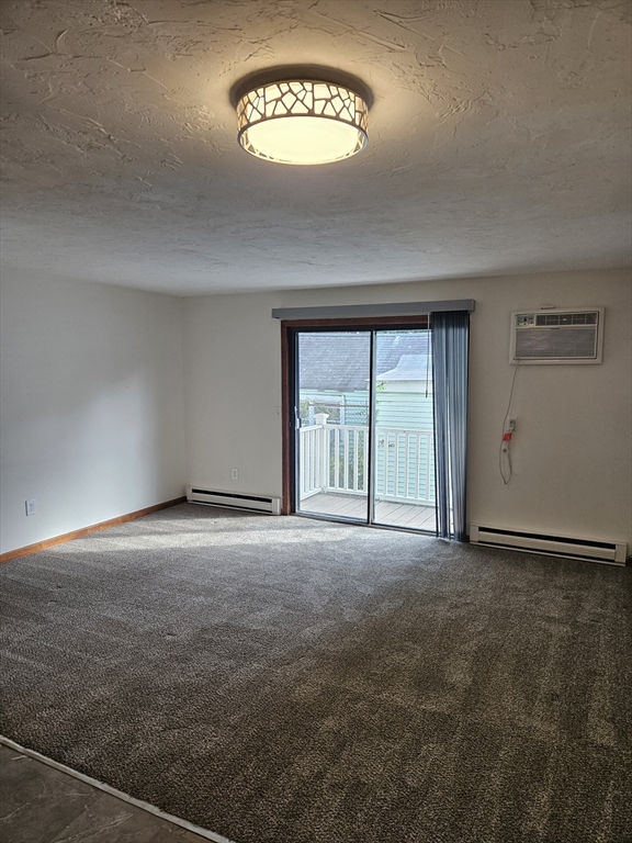 15 Houghton Street, Unit 7A Worcester, MA 01604 - Photo 2 of 7 a view of an empty room with a window