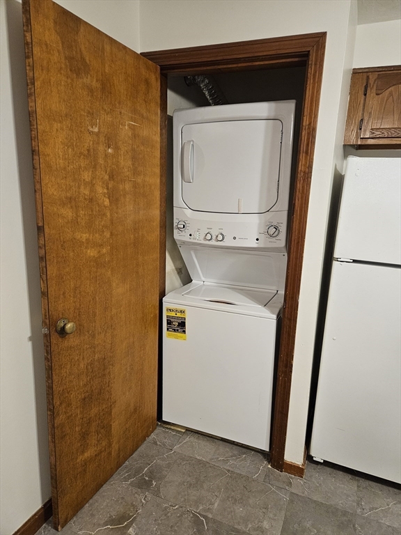 15 Houghton Street, Unit 7A Worcester, MA 01604 - Photo 4 of 7 a utility room with dryer and washer