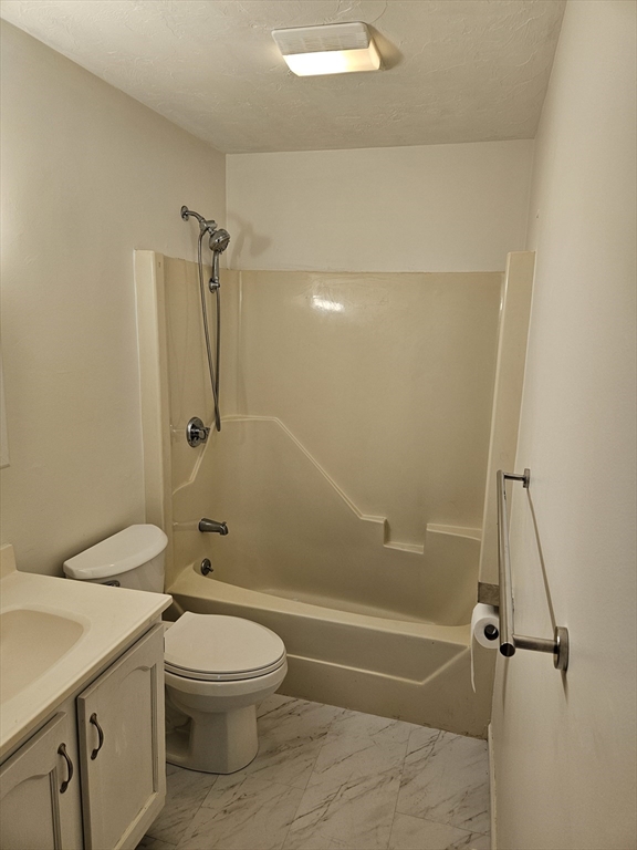 15 Houghton Street, Unit 7A Worcester, MA 01604 - Photo 7 of 7 a bathroom with a toilet sink and shower