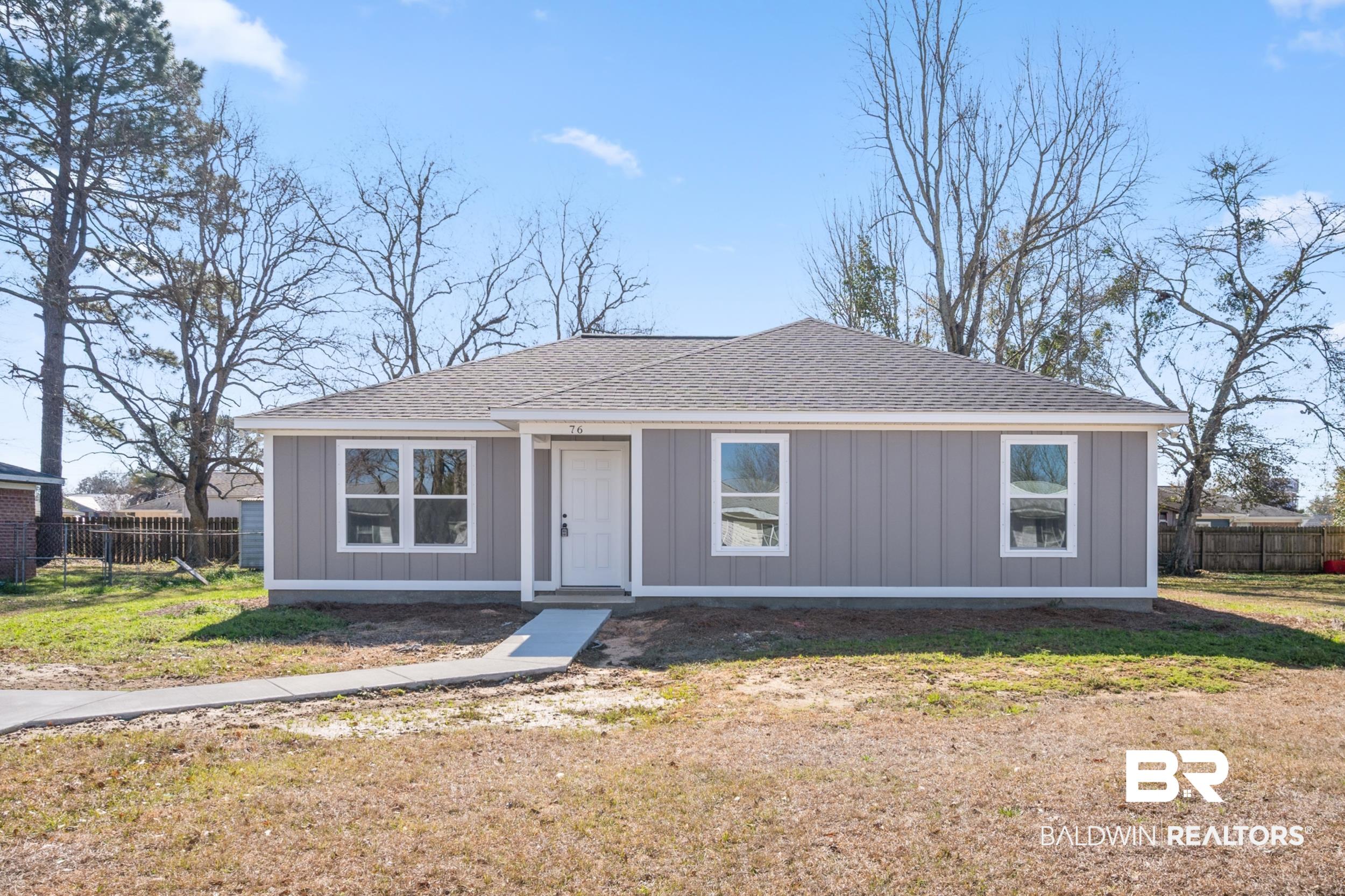 76 Fincher Lane Loxley, AL 36551 - Photo 1 of 33 View of front facade with a shingled roof and board and batten siding