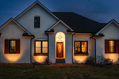 a front view of a house with a yard