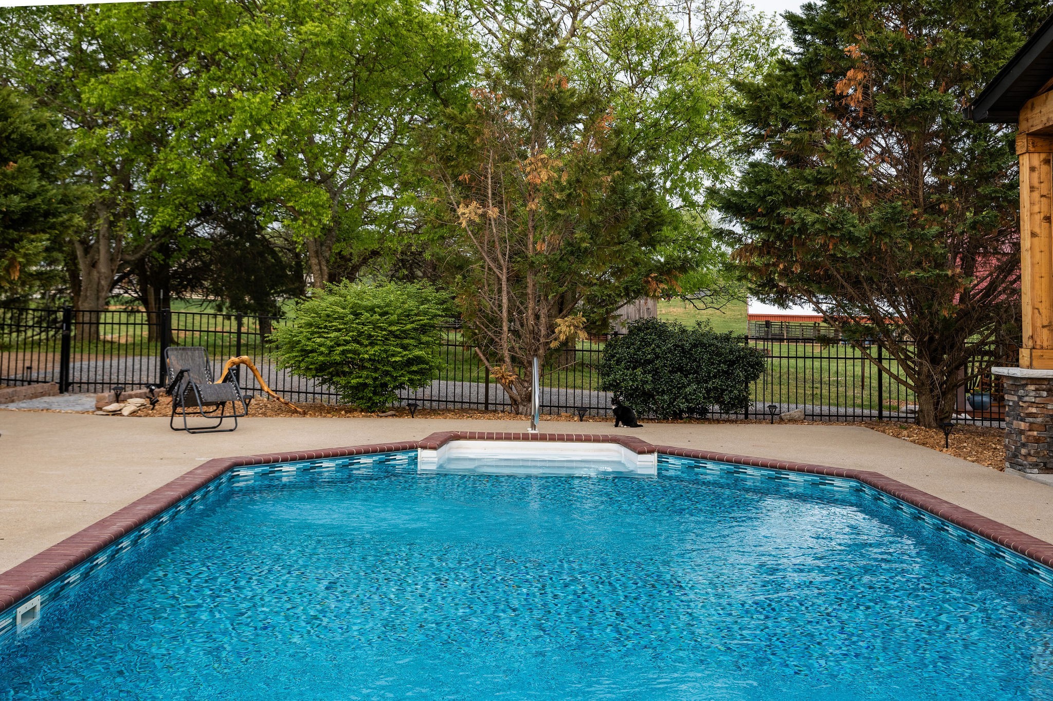 95 Old 25 Loop Hartsville, TN 37074 - Photo 59 of 99 a view of a swimming pool with an outdoor space and seating area